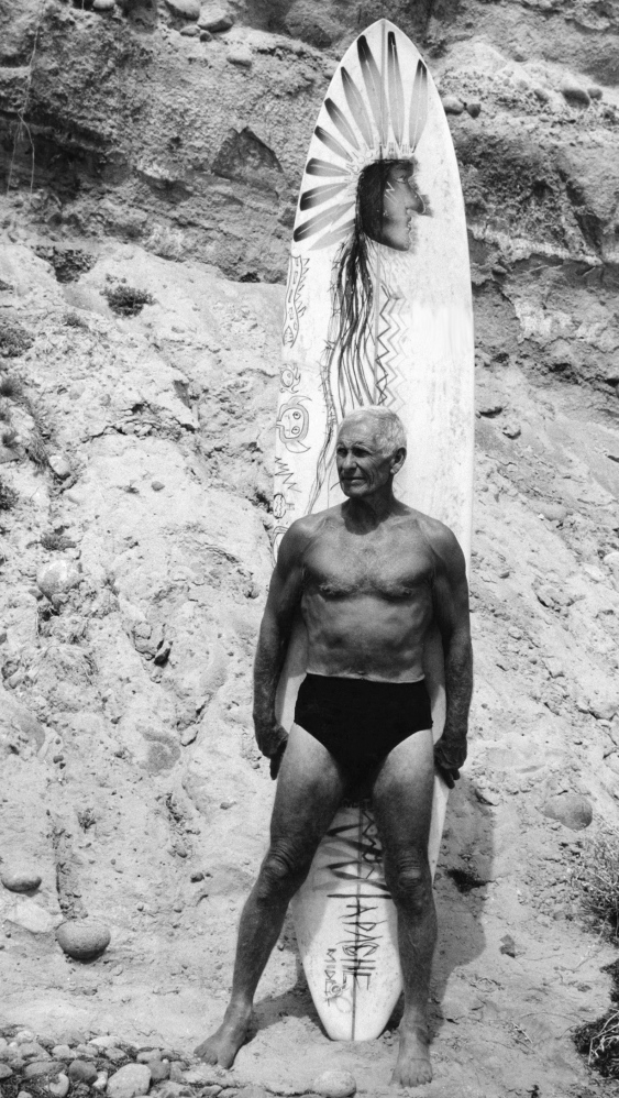 His face weathered like a seaside bluff and eyes blue like the Pacific, Dorian Paskowitz, seen in this undated image from “Surfwise,” was a doctor turned genuine beach boy.