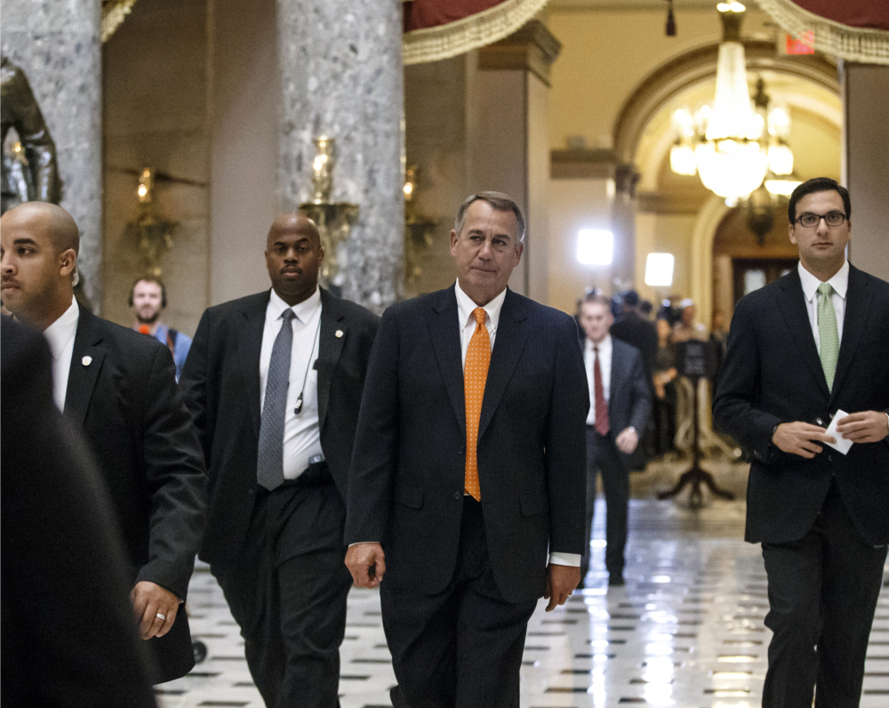 House Speaker John Boehner of Ohio walks from the House floor Friday after the Republican-controlled House approved the Keystone XL oil pipeline. The bill’s passage sets the stage for a showdown in the Senate and, possible, a difficult decision for President Obama.