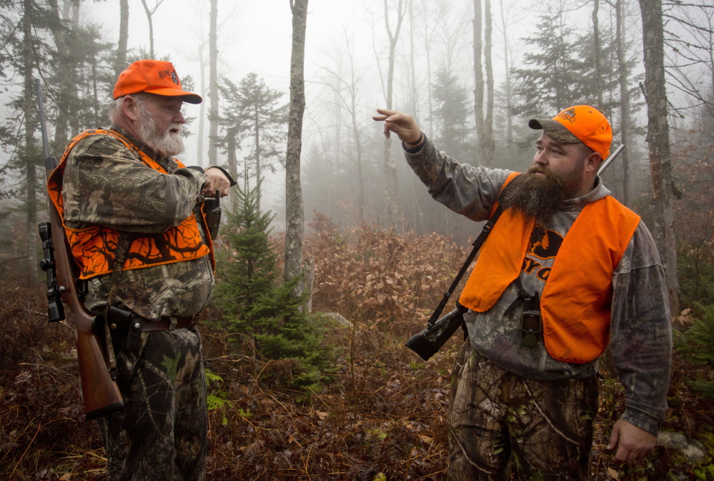 As hunting has grown safer, Maine laws have been relaxed. Now hunters can wear blaze orange in a camouflage pattern and they now are allowed to hunt 30 minutes after sunset during the fading light. The father-son team of John Vogt Sr., left, and John Jr. hunted for moose in November.