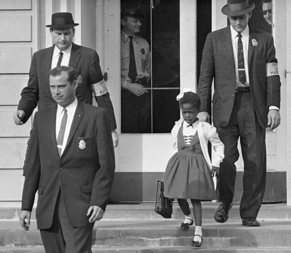 U.S. Marshals escort 6-year-old Ruby Bridges from William Frantz Elementary School in New Orleans, La., on Nov. 14, 1960. “Kids come into the world with clean hearts, fresh starts. If we are going to get through our differences, it’s going to come through them,” Bridges said.
