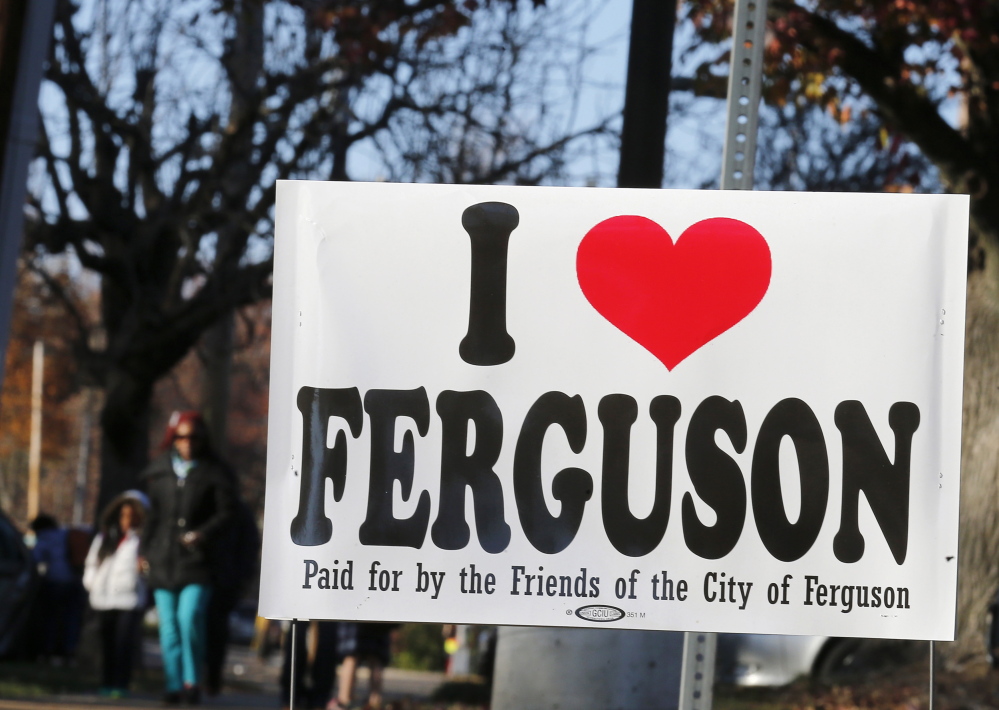 A sign is seen on a street before the verdict by the grand jury in the indictment of Darren Wilson, in Ferguson, Missouri, on Saturday. The grand jury decision on whether to indict the white Missouri police officer, Wilson, for fatally shooting a 18-year-old unarmed black teenager, Michael Brown, is nearing.