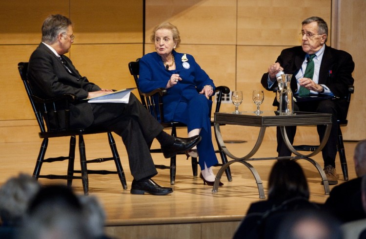 Former Secretary of State Madeleine Albright speaks with Joel Goldstein, left, as political analyst Mark Shields listens during a tribute to Edmund Muskie on Saturday.