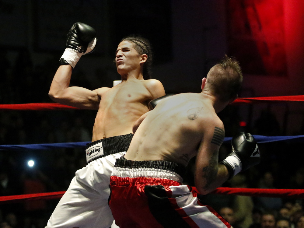 Jason Quirk of Scarborough delivers a blow to his opponent Brian Diaz during a middleweight bout at the Portland Expo. Quick won when Diaz quit in the first minute.