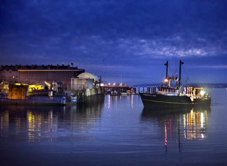 The trawler Isabella and Ava arrives at dawn to unload its catch at the Portland Fish Exchange. New England’s fishery is hoping recent investment from the state in the Portland Fish Exchange can help sustain the facility, which is vitally important to the region’s flagging groundfish industry.