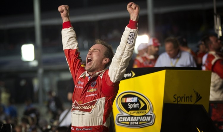 Kevin Harvick celebrates winning the NASCAR Sprint Cup championship series auto race Sunday in Homestead, Fla.