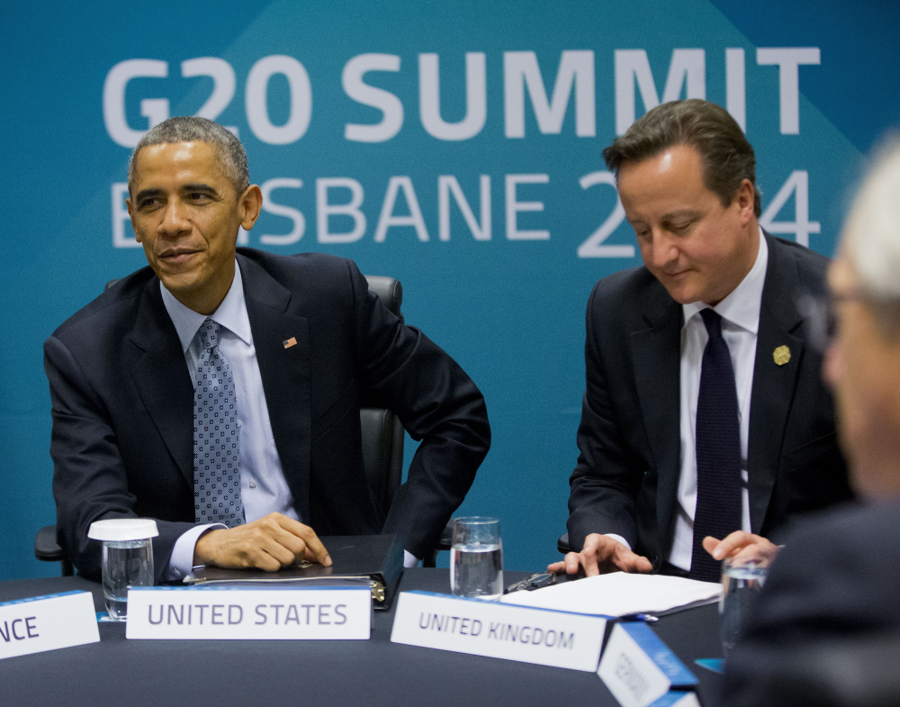 President Obama and British Prime Minister David Cameron, right, meet with other European leaders at the G20 Summit to discuss transatlantic trade Sunday in Brisbane, Australia. The Associated Press