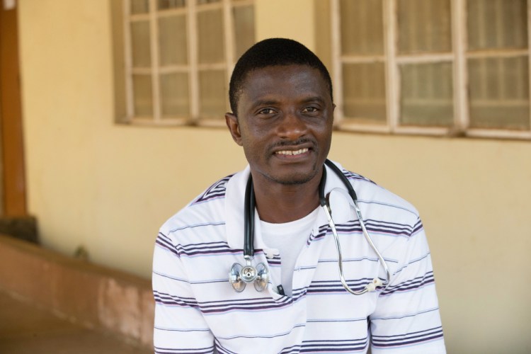 In this April 2014 photo provided by the United Methodist News Service, Dr. Martin Salia stands outside the church’s Kissy Hospital near Freetown, Sierra Leone. Salia, who was diagnosed with Ebola on Monday, landed in Omaha, Neb., on Saturday, and was  transported to the Nebraska Medical Center. The Associated Press