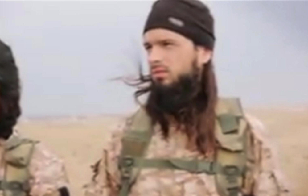 This still image taken from an undated video published on the Internet by the Islamic State group and made available Sunday shows a militant who the French government says is Frenchman Maxime Hauchard.