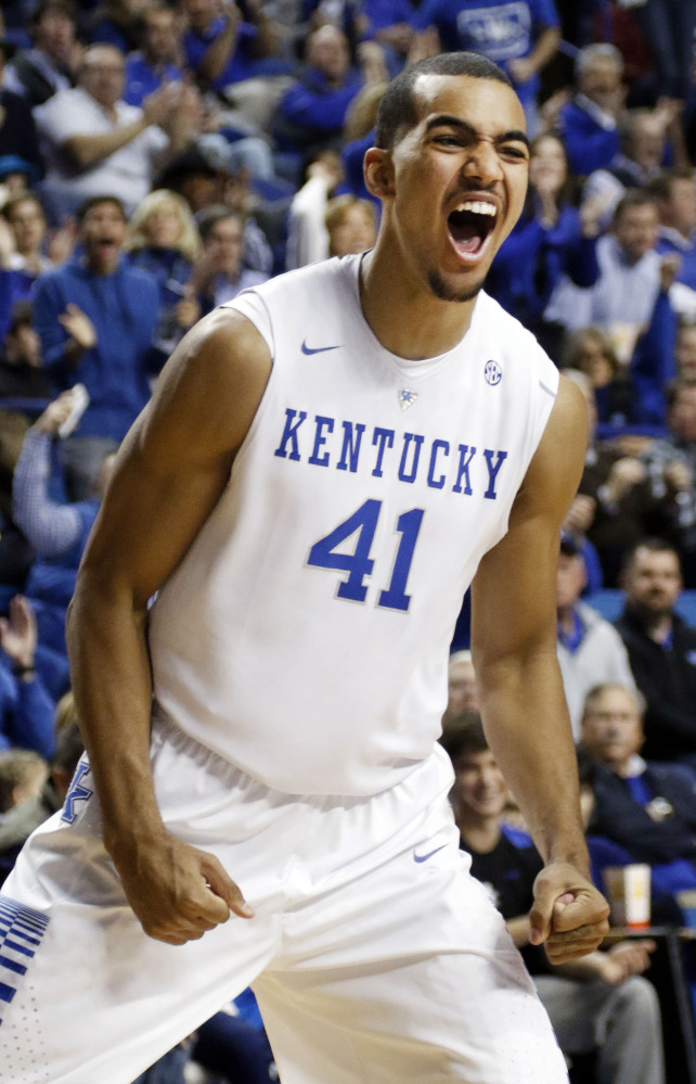 Kentucky’s Trey Lyles celebrates after his dunk during the second half of an NCAA college basketball game against Buffalo on Sunday in Lexington. Kentucky won 71-52.