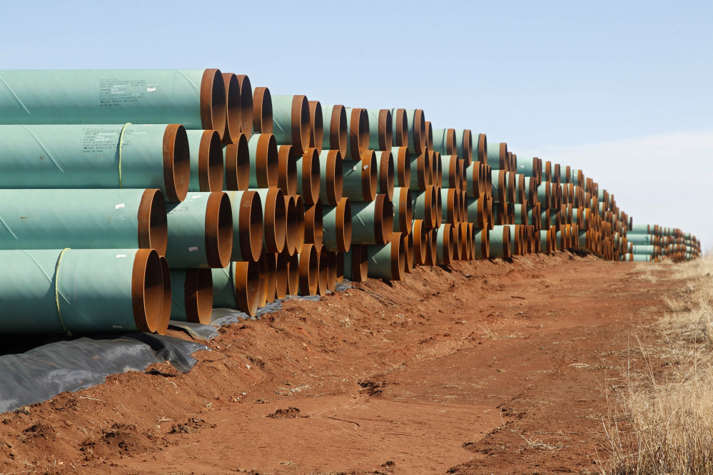 Miles of pipe ready to become part of the Keystone Pipeline are stacked in a field near Cushing, Okla.