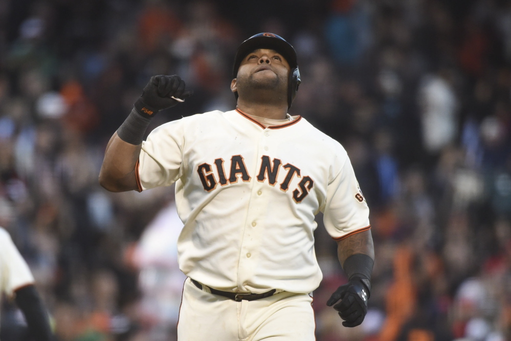 San Francisco Giants third baseman Pablo Sandoval celebrates after hitting a home run against the St. Louis Cardinals last summer.
The Associated Press