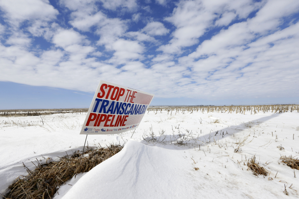 A sign reading “Stop the Transcanada Pipeline” stands in a field near Bradshaw, Neb., along the Keystone XL pipeline route through the state. With the clock ticking, supporters of a Senate bill to approve the Keystone XL pipeline are still scrambling to find the last vote.