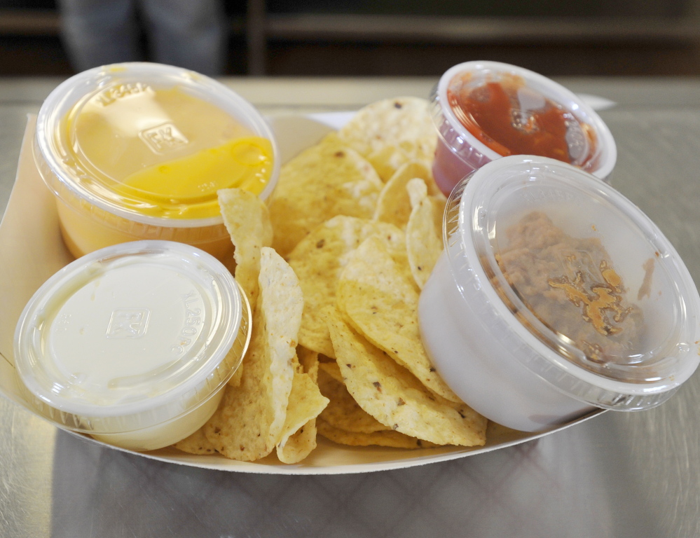 Nachos with cheese, sour cream, salsa and pinto beans are a vegetarian entrée at Kennebunk High.