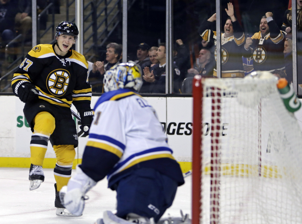 Bruins defenseman Torey Krug celebrates his goal against St. Louis Blues goalie Brian Elliott during the second period of Tuesday night’s win for Boston.