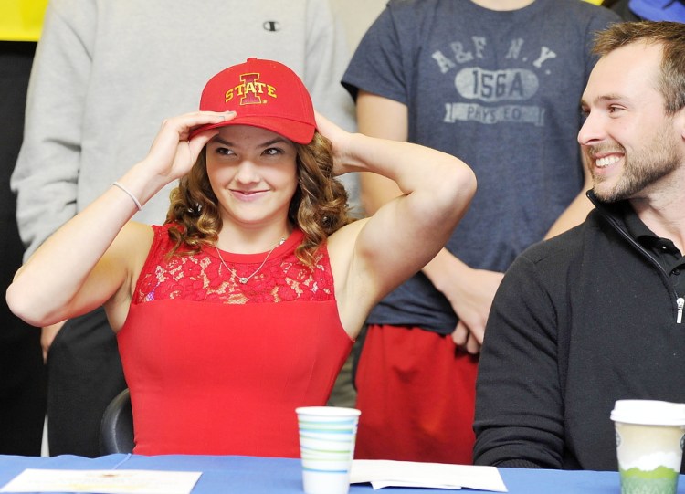 Kate Hall may be one of the best track and field athletes the state has produced, and Tuesday she made it official where her next challenge will lie. Hall, with her trainer, Chris Pribish looking on at Lake Region High in Naples, signed a national letter of intent to attend Iowa State next year. Hall wasn’t the only Maine high school athlete making choices official Tuesday night. Jacob Dixon of Cheverus, a sprinter, signed with the University of Virginia. Ashley Briggs of Scarborough will play basketball for Saint Anselm College, a Division II school in Manchester, N.H., and Cody Hughes of Marshwood in South Berwick will take his wrestling talents to Virginia Tech.