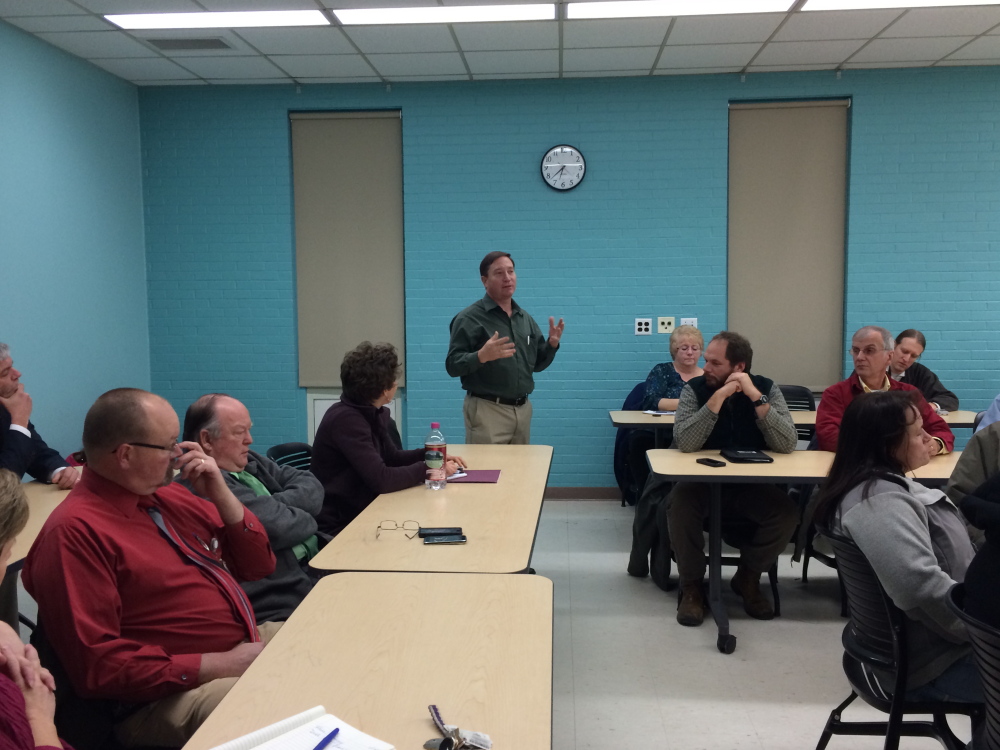 Bill Crandaw, program manager at Western Maine Community Action, speaking Wednesday in Farmington during a community forum on alternative energy, calls for the University of Farmington to start using wood pellets to heat the university campus.