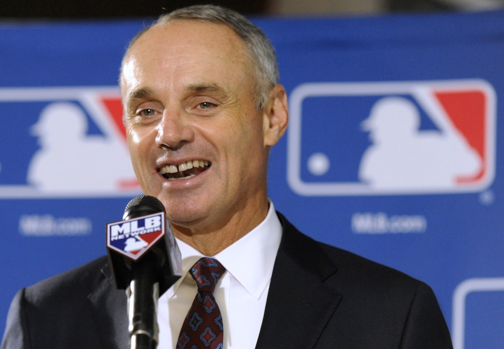 Major League Baseball Chief Operating Officer Rob Manfred will become commissioner in January, with a five-year term that team owners approved Thursday.