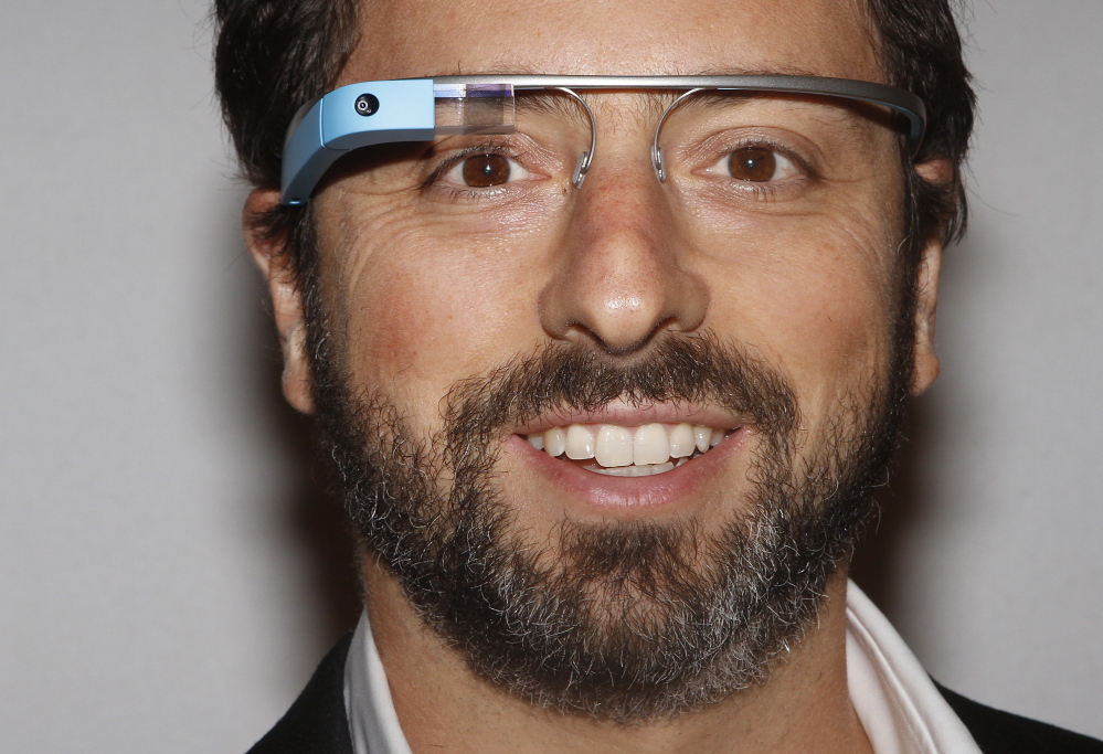 Google founder Sergey Brin poses for a portrait wearing Google Glass glasses.
