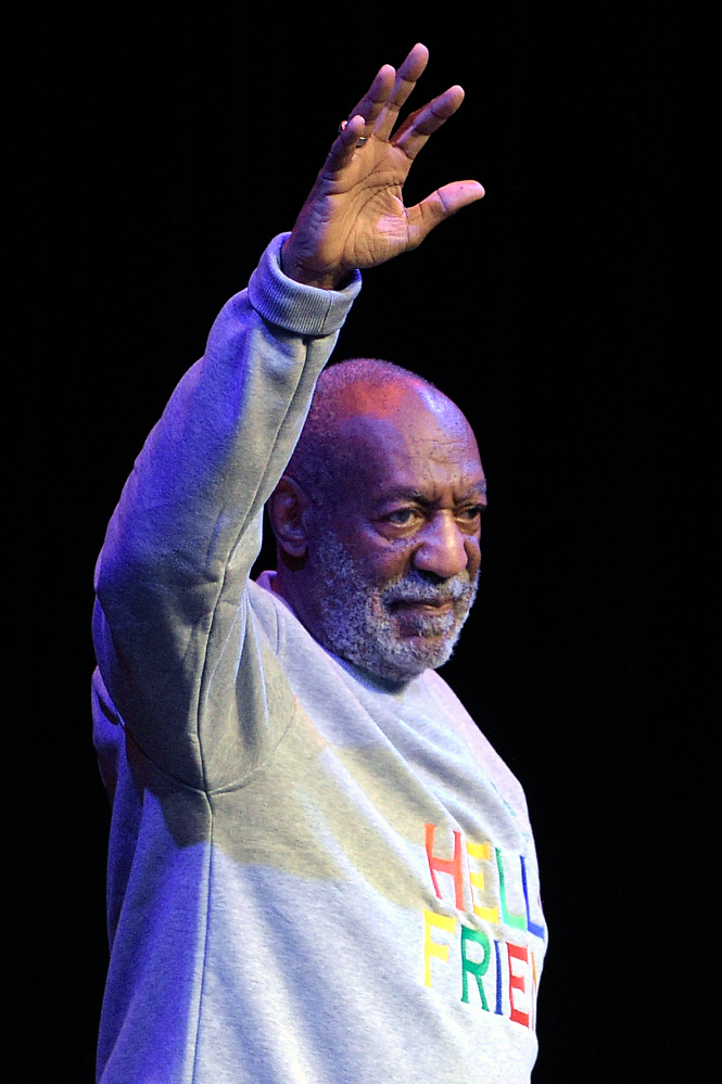 Comedian Bill Cosby waves to the crowd as he walks onstage at the beginning of his performance at the Maxwell C. King Center for the Performing Arts, in Melbourne, Fla., Friday, Nov. 21, 2014. Performances by Cosby in Nevada, Illinois, Arizona, South Carolina and Washington state have been canceled as more women come forward accusing the entertainer of sexually assaulting them years ago. (AP Photo/Phelan M. Ebenhack)