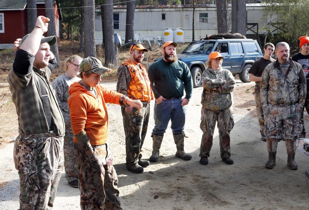 Hunters gather at the deer check station in Hillsboro, N.H. State officials hope local food connoisseurs will grow the number of licensed hunters.