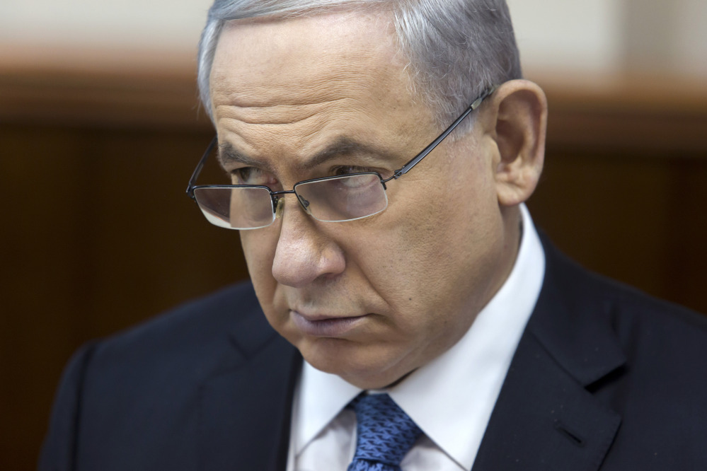Israeli Prime Minister Benjamin Netanyahu listens during in his Cabinet meeting in his office in Jerusalem on Sunday. At the start of the meeting, Netanyahu called for a bill that would revoke residency rights for Palestinians involved in attacks against Israelis.