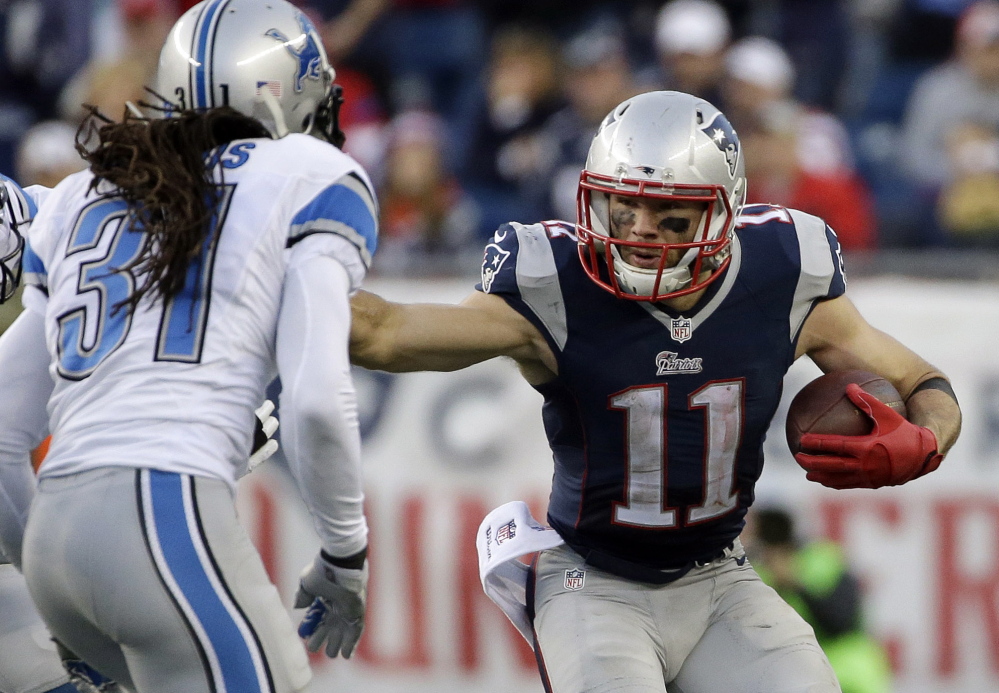 Julian Edelman of the Patriots is pursued by Lions cornerback Rashean Mathis after one of his season-high 11 receptions on Nov. 23.