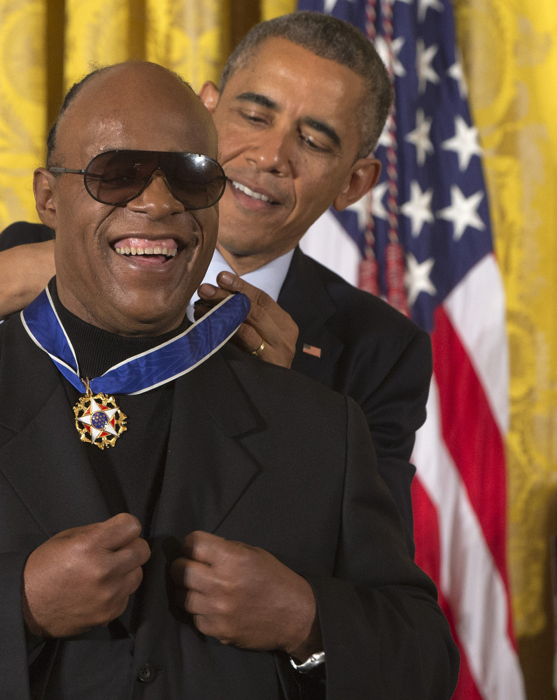 President Obama awards musician Stevie Wonder the Presidential Medal of Freedom on Monday.