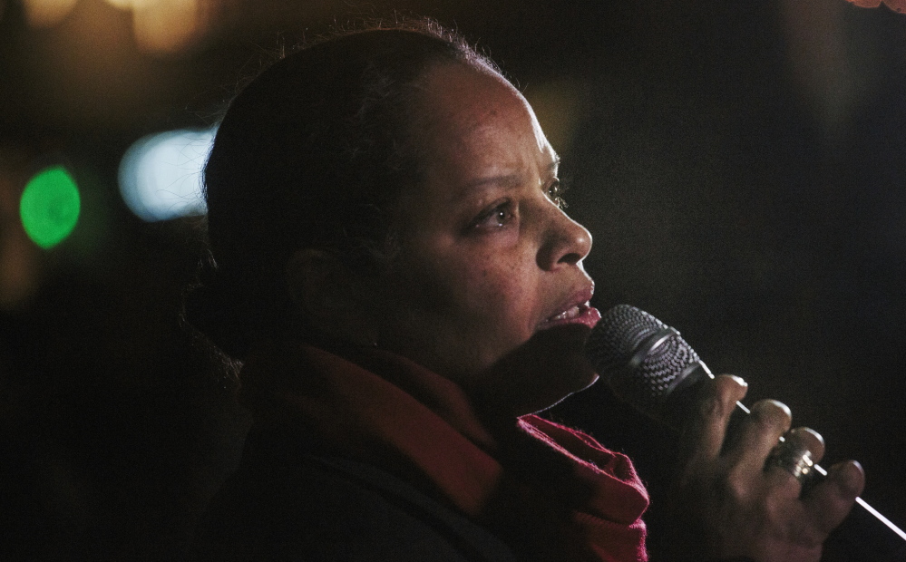Maine NAACP director Rachel Talbot Ross, reading “What Shall I Tell My Children Who Are Black,” was one of the speakers in Monument Square on Tuesday night addressing events in Ferguson, Mo.