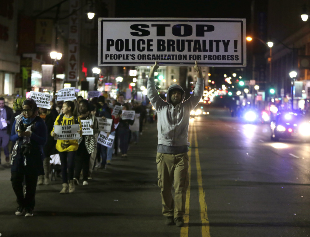 NEWARK: Cliff Rogers marches Tuesday during a rally in response to a grand jury deciding not to indict Ferguson, Mo., police Officer Darren Wilson. 