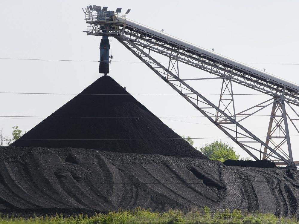 Coal is piled at North Omaha Station, a coal-burning power station in Omaha, Neb. The EPA announced Wednesday that it prefers a lower threshold for smog-forming pollution.