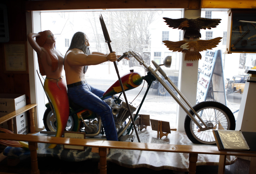 A life-size wood carving is displayed in the front window of the Maine State Prison store in Thomaston. The prison system also has a store in Windham that sells the handicrafts of inmates – everything from cutting boards to Adirondack chairs.