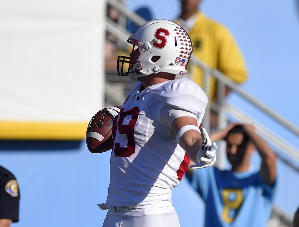 Stanford wide receiver Devon Cajuste celebrates after making a touchdown catch during the first half of Friday’s game against UCLA in Pasadena, Calif.