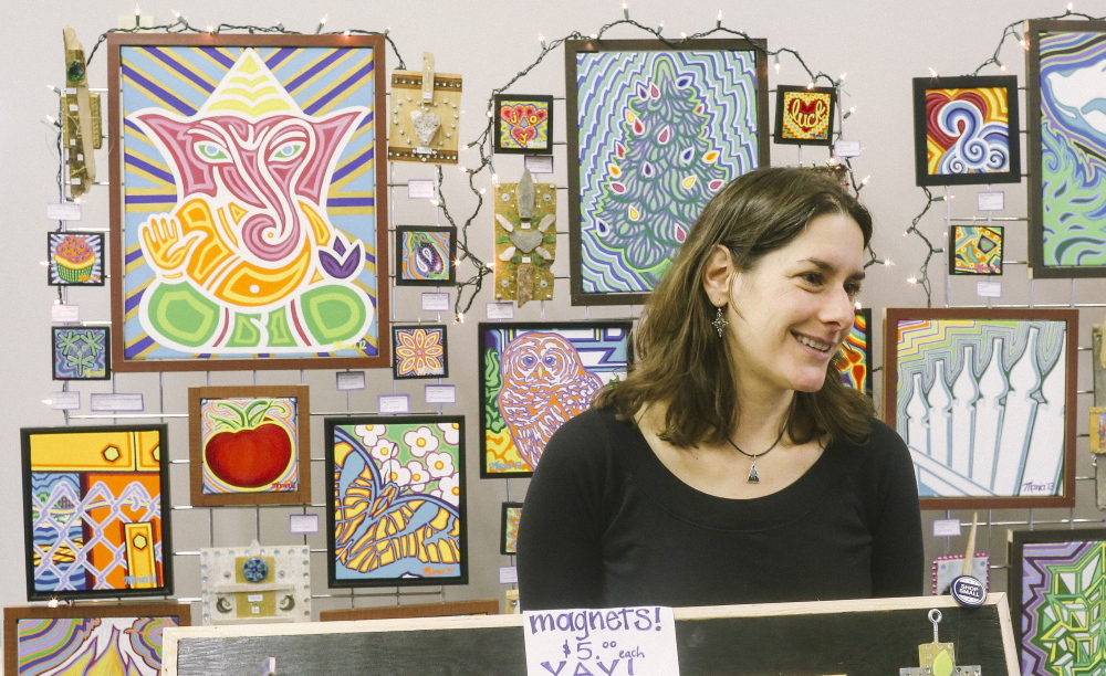 Maria Castellano-Usery sells her acrylic paintings and mixed-media artwork at the one-day-only Artisan Pop-Up Shop at 90 Maine St. in Brunswick on Small Business Saturday. “I heard there was a free space to show my work, so I jumped on it as soon as I heard about it,” she said.