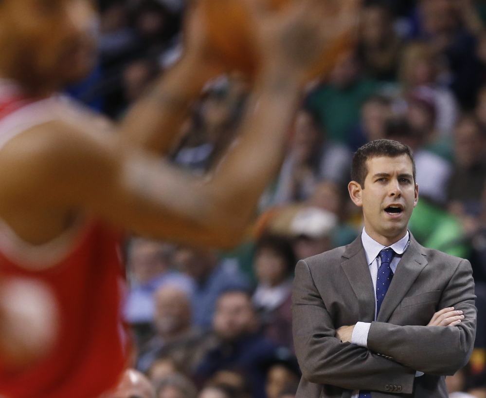 Celtics Coach Brad Stevens instructs from the bench during the first half of Friday’s 109-102 loss to the Bulls in Boston. Despite a rough stretch, Stevens remains cool in public.