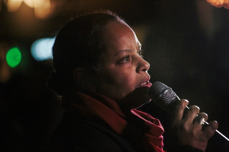 Rachel Talbot Ross gives a reading of "What Shall I Tell My Children Who Are Black," during a rally held Tuesday night in Portland's Monument Square in response to a Missouri grand jury's decision to not indict Officer Darren Wilson in the killing of Michael Brown in Ferguson.