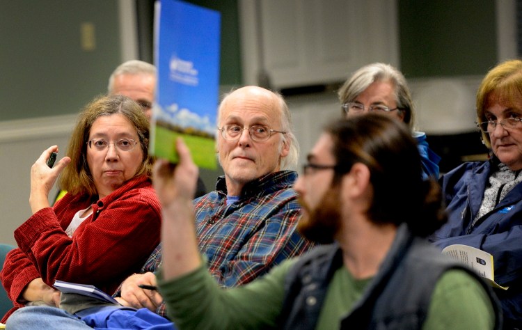 Charlotte and James Hurd of Cumberland listen to comments during Monday night's Town Council meeting, where residents shared their stories about Dave Ireland Builders. Ireland took deposits of thousands of dollars for heating systems in Cumberland, Yarmouth and Falmouth that he apparently will never install.