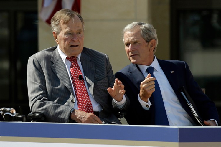 Former President George W. Bush, right, and his father, former President George H.W. Bush, have no plans to endorse Donald Trump.