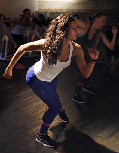 Kelly Brabants leads her "Booty by Brabants" class at The Club by George Foreman III gym in Boston. The Associated Press