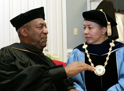 Bill Cosby and Spelman College President Dr. Beverly Tatum talk before the start of commencement at the school in Atlanta in this May 14, 2006, photo. The Associated Press