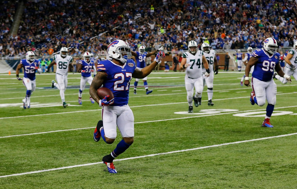 Buffalo Bills strong safety Duke Williams returns an interception pass thrown by New York Jets quarterback Michael Vick and returns it for 16-yards during the second half of an NFL football game in Detroit, Monday. The Associated Press
