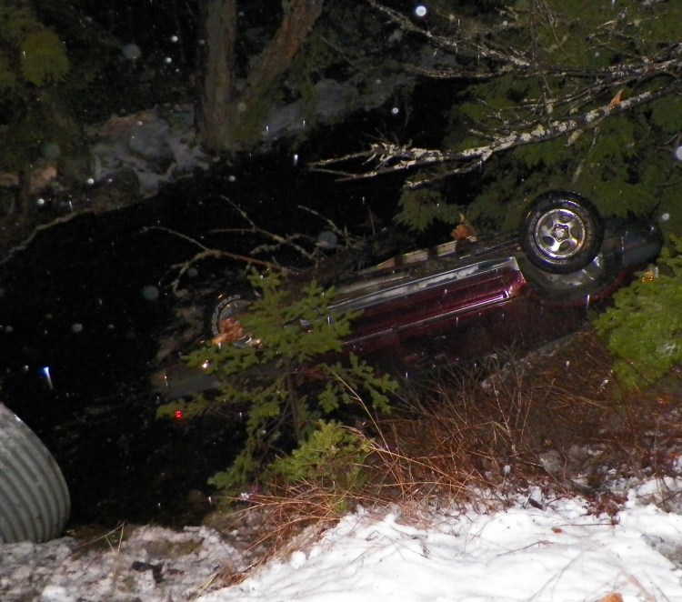 In this photo an SUV where a passerby pulled an infant trapped and submerged inside the vehicle. Photo courtesy of Maine State Police