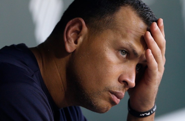 New York Yankees' Alex Rodriguez wipes sweat from his brow as he sits in the dugout before a baseball game against the Baltimore Orioles in Baltimore Sept. 11, 2013, file photo. The Associated Press