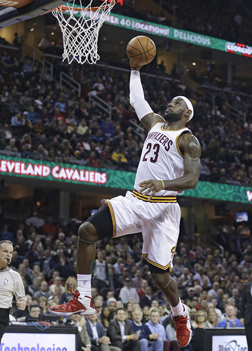 Cleveland Cavaliers' LeBron James drives to the basket against the Orlando Magic on Monday in Cleveland. 