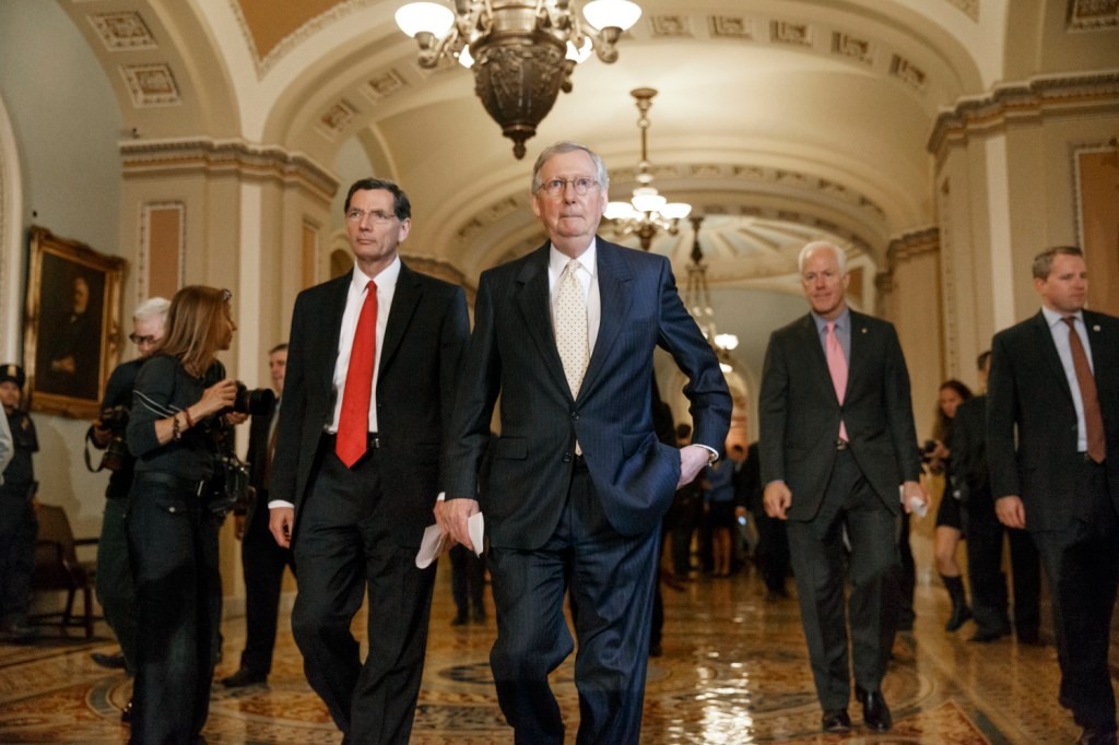 Senate Minority Leader Mitch McConnell of Kentucky, center, flanked by Sen. John Barrasso, R-Wyo., left, and Senate Minority Whip John Cornyn of Texas, right, arrive for a news conference on Capitol Hill in Washington. All along, the biggest question this election was whether Republicans could take over the Senate and add it to their solid House majority.