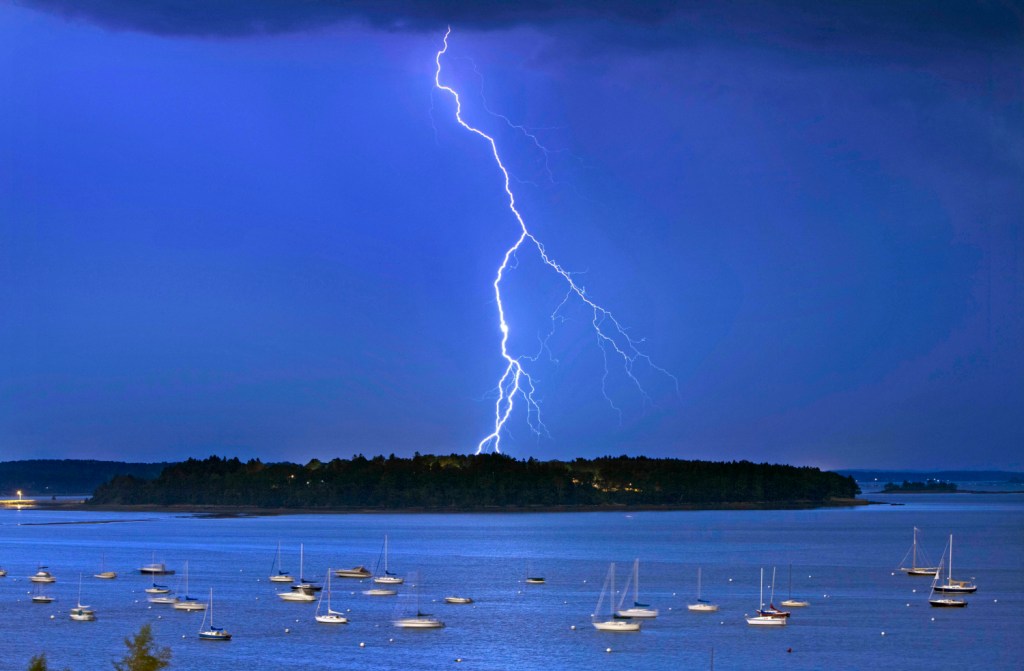 Lightning strikes north of Macworth Island in Portland. A new study says flashes of lightning in the U.S. will likely increase by nearly 50 percent by the end of the century because of climate change. 