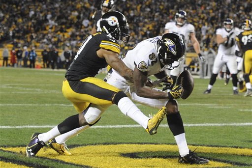 Baltimore Ravens wide receiver Torrey Smith (82) can't make a catch as Pittsburgh Steelers defensive back Antwon Blake (41) defends in the fourth quarter Sunday in Pittsburgh. 
The Associated Press