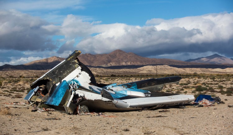 Wreckage lies near the site where a Virgin Galactic space tourism rocket, SpaceShipTwo, exploded and crashed in Mojave, Calif. The Friday explosion killed a pilot aboard and seriously injured another while scattering wreckage in Southern California's Mojave Desert, witnesses and officials said. The Associated Press