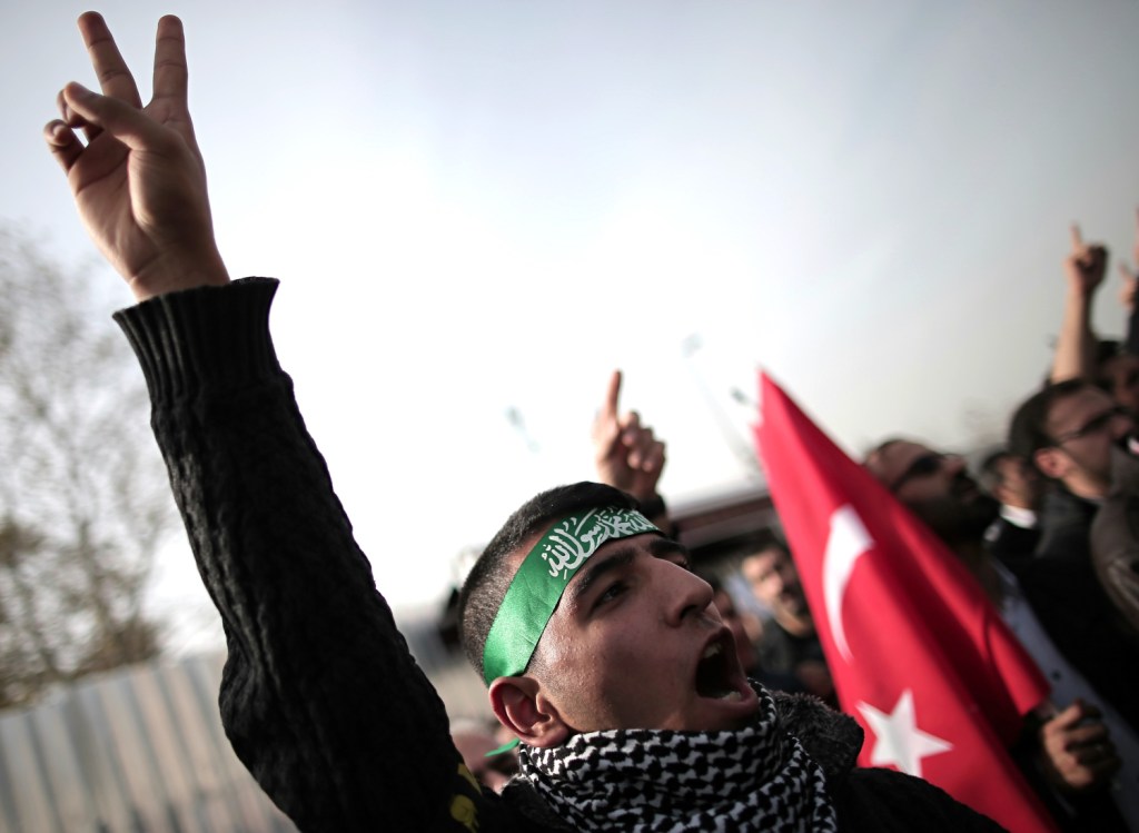 A pro-Palestinian Turk shouts slogans during a protest against Israeli restrictions at the Al-Aqsa Mosque in Istanbul, Turkey, on Friday. Other protesters who object to a U.S. presence in the region roughed up three American sailors Wednesday.