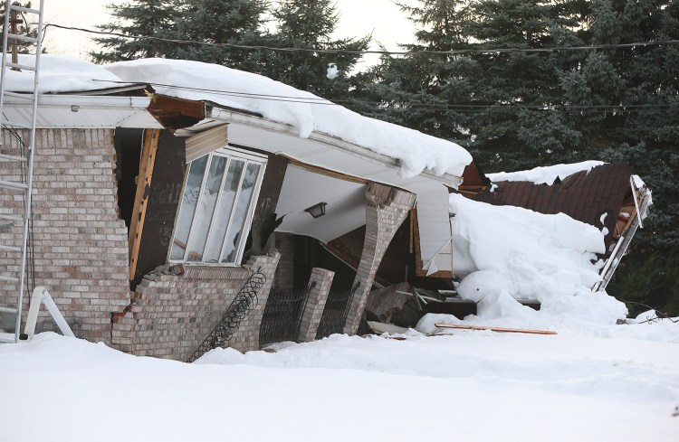 A collapsed home in Alden, N.Y.