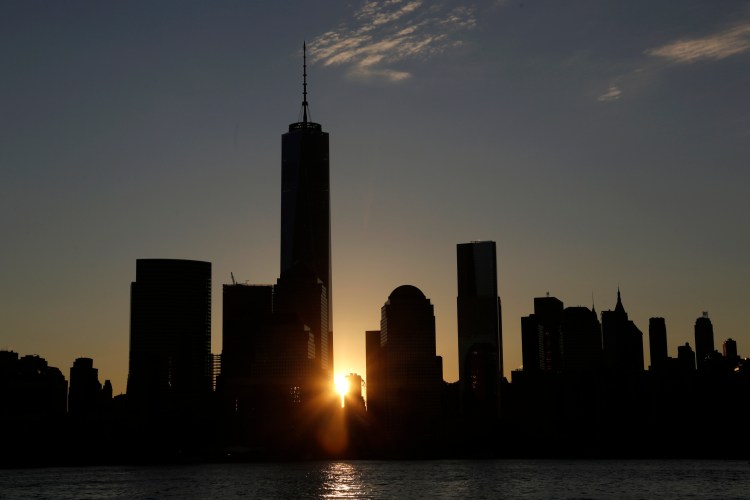 One World Trade Center dominates the lower Manhattan skyline at sunrise as seen from Jersey City, N.J., on Monday. It is America's tallest building. The Associated Press